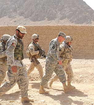 U.S. Army General David H. Petraeus visits with U.S, NATO, and Afghan forces, at checkpoint 91, July 9, 2010 in Kandahar, Afghanistan.