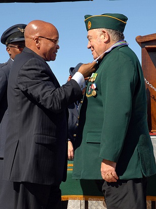 South African President Jacob Zuma awards Ronnie Kasrils with the Military Veterans Decoration in Platinum Class III in Bloemspruit Airforce Base, Bloemfontein, August 2, 2012. (Photo: <a href=