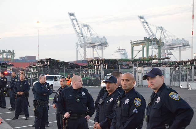 Police officers on site as Oakland port truckers strike in November, 2013.