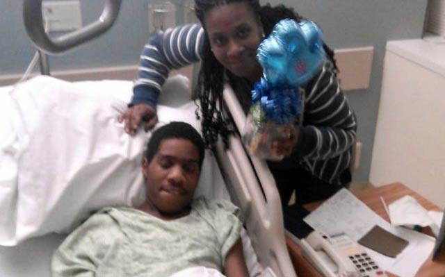 Willette Middleton and son Tykwon Davis, recovering in the hospital after being shot by police in October, 2014. (Courtesy of Willette Middleton)