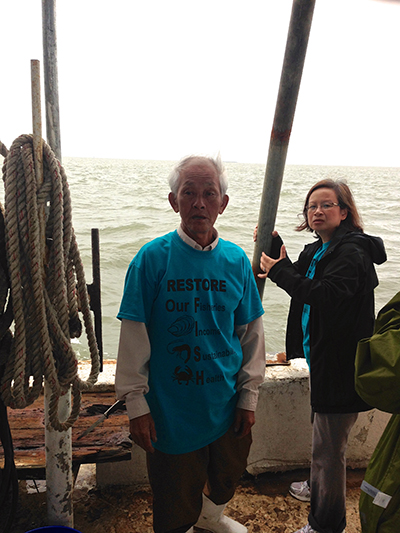 Captain Bien Do and Thao Vu on board Do's fishing boat off the Mississippi coast Gulf of Mexico. Do has been fishing in the Gulf since he came to United States from Vietnam in 1990, and Vu is an advocate for the local Vietnamese fishing community. Vu says small fishing operations are still struggling with the 