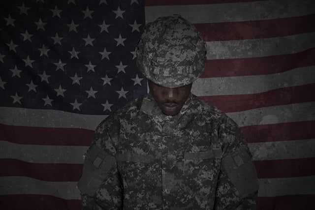 Black service members salute and pledge an oath of loyalty to a country that does not protect them after they have protected it. (Photo: Soldier's Portrait via Shutterstock; edited: LW / TO)