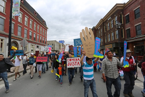   Migrant Justice farm workers march on the Vermont Statehouse May 1st. (Photo: Jonathan Leavitt)