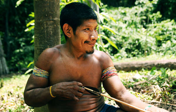 Awá man making arrows, Brazil. The Awá have an intimate knowledge of their rainforest and are extremely skilled hunters. (Photo: Survival International)