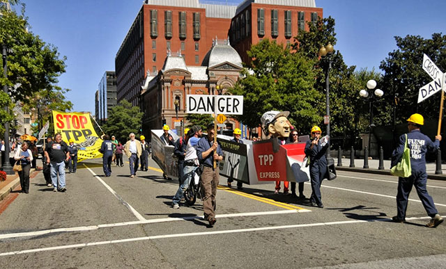 An October 2013 protest against the Trans Pacific Partnership. Tufts researchers found that while the US job market is projected to take the biggest hit, the TPP would lead to 771,000 job aggregate losses over the next ten years in all member nations.