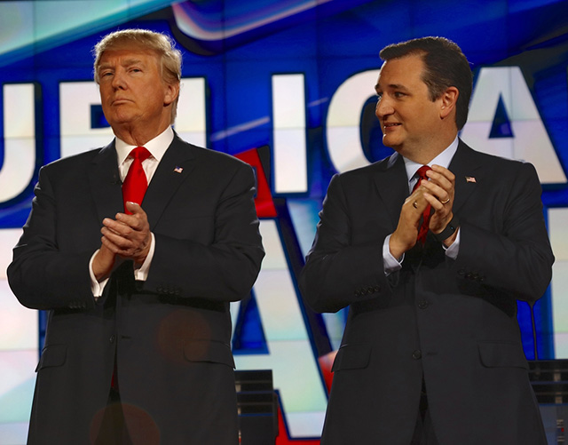 Republican presidential candidates US Senator Ted Cruz and Donald J. Trump clap at CNN republican presidential debate on December 15, 2015, in Las Vegas, Nevada. (Photo via Shutterstock)
