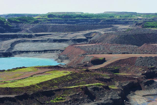 A portion of the Hull-Rust Mahoning mine in Hibbing, Minnesota, a 1.5 mile long open-pit iron mine. Minnesota is considering sulfide mining as a potential investment. Sulfide mines are notorious for producing highly toxic contaminants that easily leach into waterways.