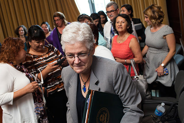EPA Administrator McCarthy, foreground, exits a meeting in June, 2015, after listening to farmworkers' personal testimonies in support of a strengthened Worker Protection Standard. (Photo: Dave Getzschman for Earthjustice)
