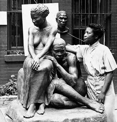 Augusta Savage with one of her sculptures for the Federal Art Project, 1938.
