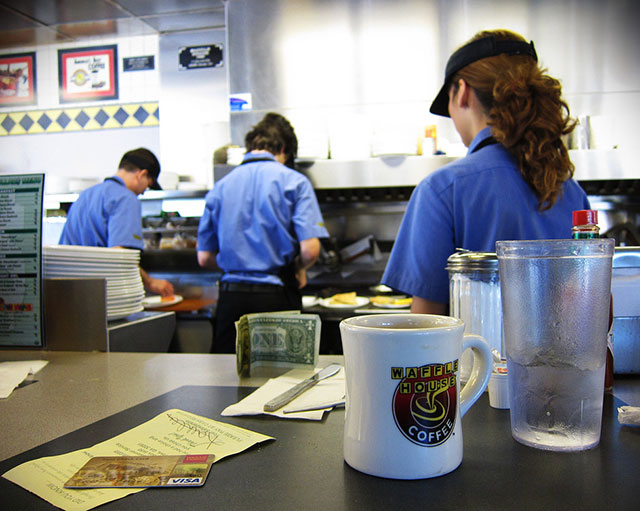 Workers prepare food in a Waffle House in Texas. (Photo: Neff Conner)