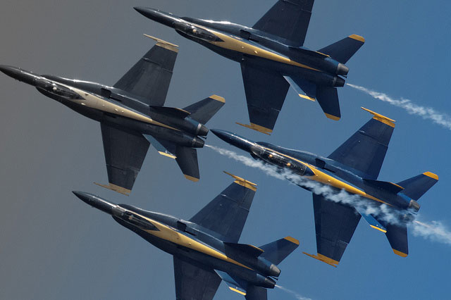 F-18 Hornets fly as part of an aerial demonstration by the US Navy's Blue Angels. A Navy F-18 went down during one of these demonstrations with one pilot killed on the same day an Air Force F-16 Fighting Falcon went down in a separate demonstration.