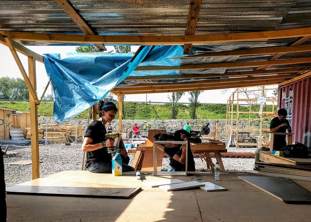 Volunteers work at the camp in Grande-Synthe, France, on May 11, 2016. (Photo: OSCE Parliamentary Assembly)