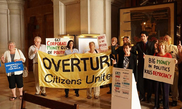 Activists celebrate in Albany, New York, after the state's Legislature called for a constitutional amendment to overturn Citizens United. (Photo courtesy of Public Citizen.)