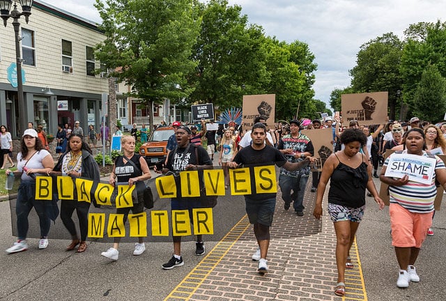 Following the police shooting death of Philando Castile, in Falcon Heights, Minnesota, community members march from the Governor's mansion to J.J. Hill Montessori School where Castile worked, and back to the Governor's mansion, in St. Paul. July 7, 2016.