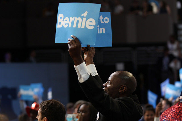Bernie supporters raise their signs at the Democratic National Convention, July 25, 2016. In a week when Democrats focused on the national election, progressives emphasized the need for local organizing.