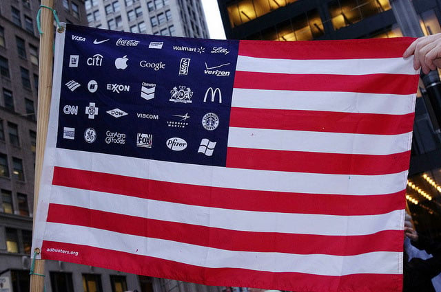 An activist displays a stylized US flag at an Occupy Wall Street rally in New York City on September 18, 2011. (Photo: David Shankbone)