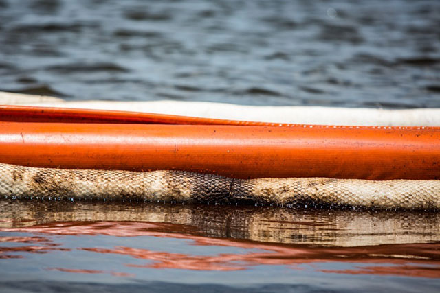 Crude oil on boom used to contain the Hilcorp oil spill. (Photo: Julie Dermansky)