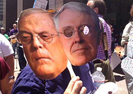 Koch Brothers mask in protest