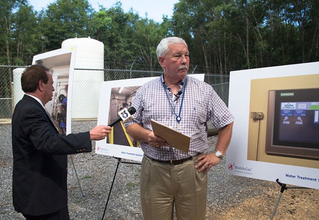 Bill Gardner talks to the media at a water treatment system site in Eight Mile. (Photo: Julie Dermansky)