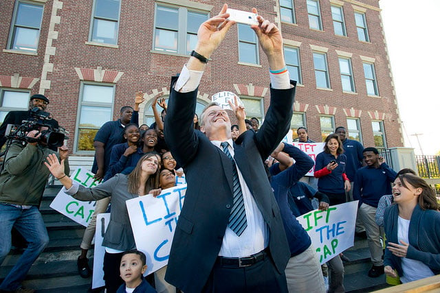 Republican Gov. Charlie Baker of Massachusetts poses for a selfie with supporters of his effort to lift the state's cap on charter schools. Charters are facing formidable opposition this election season: Democrats passed a resolution this month opposing the proposed charter school expansion in Massachusetts, and residents will vote on the proposal in November.