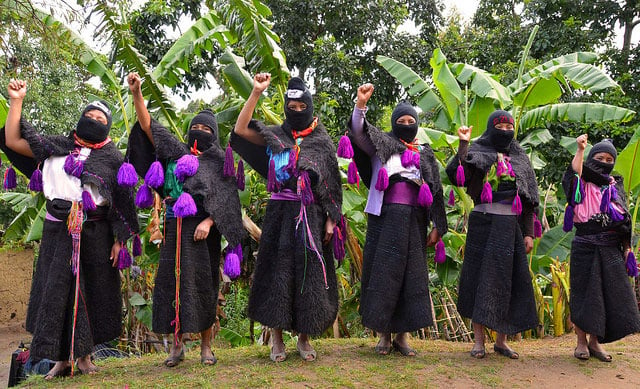 Zapatista women standing with raised fists in January, 2014.