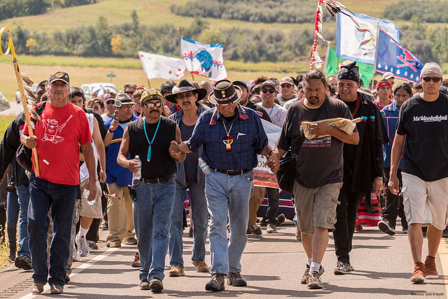 Native activists march in opposition to the Dakota Access Pipeline at the Sacred Stone camp in Cannonball, North Dakota. (Photo: Joe Brusky)