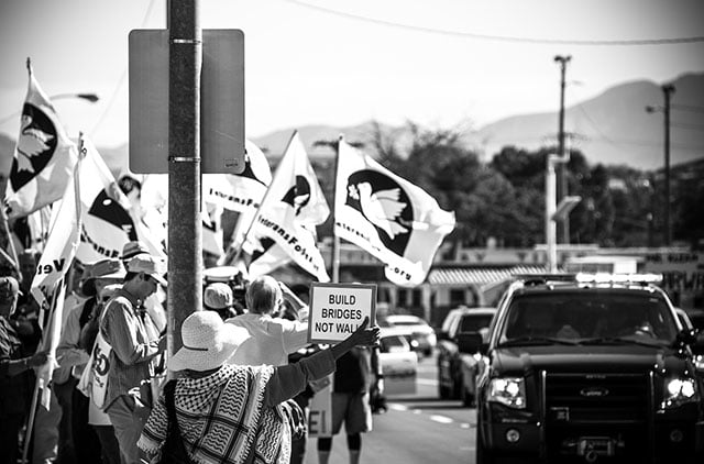 Led by US military veterans, SOA Watch activists march to the border wall on October 8 for the binational rally of the SOA Watch Border Convergence. (Photo: Steve Pavey)