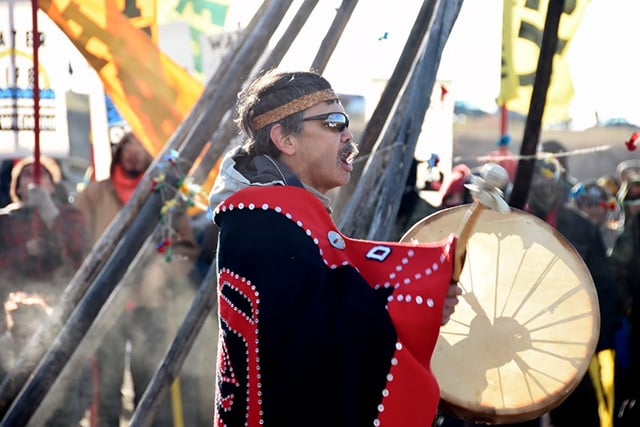 An Indigenous drummer and singer takes part in a prayer ceremony at the Dakota Access pipeline on October 10, 2016. (Photo: Ellen Davidson)