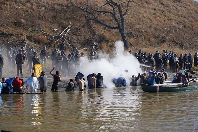 Protectors were attacked by police with tear gas and rubber bullets last Wednesday, but held their ground in extremely cold waters. (Photo: Johnny Dangers)