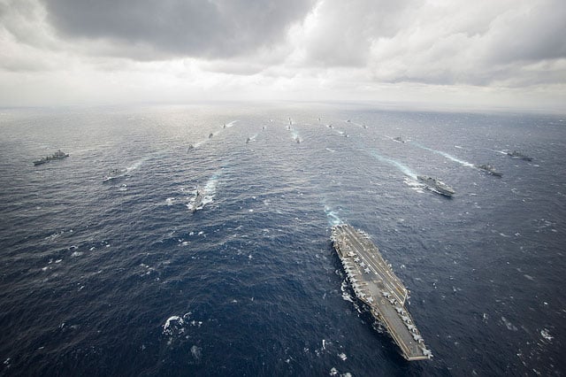 US Navy forces engage in maneuver training in the Philippine Sea, November 28, 2013. The massive amount of heavy metals and highly toxic compounds the Navy introduces into the environment will not be cleaned up by the Navy, nor will the Navy contribute to medical tests for people whose health may suffer.