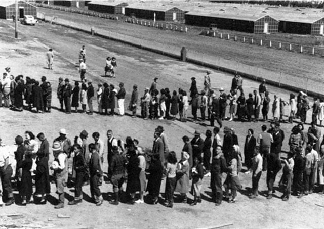 Newly arrived Japanese prisoners line up outside of the mess hall at a Japanese internent camp in San Bruno, California, on April 29, 1942. (Photo: Executive Office of the President of the United States)