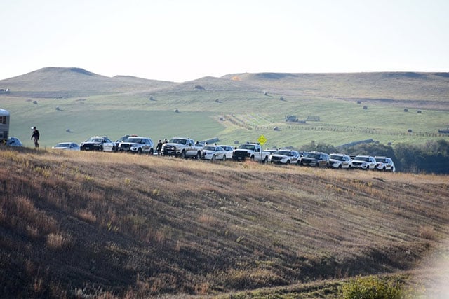Three rows of police cars block the road near the Standing Rock camp near Cannon Ball, North Dakota, during the protest against the Dakota Access Pipeline on October 10, 2016. (Photo: Ellen Davidson)