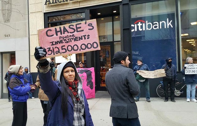 Protesters with Lifted Voices and The American Indian Center rally in solidarity with the Water Protectors at Standing Rock outside a CitiBank in Chicago, Illinois, during a national day of action last week. Activists across the country are closing accounts with banks financing the Dakota Access Pipeline and urging state and local governments to do the same.