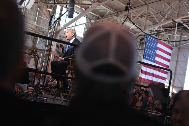 Donald Trump speaks with the media at a hangar at Mesa Gateway Airport in Mesa, Arizona, on December 16, 2015. (Photo: Gage Skidmore)