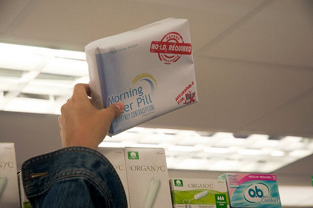 An activist holds an emergency contraception package as part of a flash mob protest against it's unavailability over the counter, May 14, 2013. A new bill would protect providers from federal, state, and local abortion mandates if they conscientiously object.