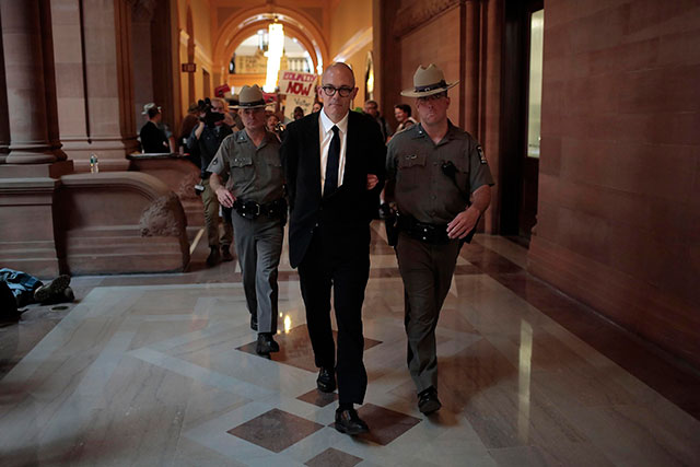 Michael Kink is arrested during civil disobedience at the New York State Capitol in Albany in June 2013 with a multi-issue activist coalition. (Photo: Nathaniel Brooks)