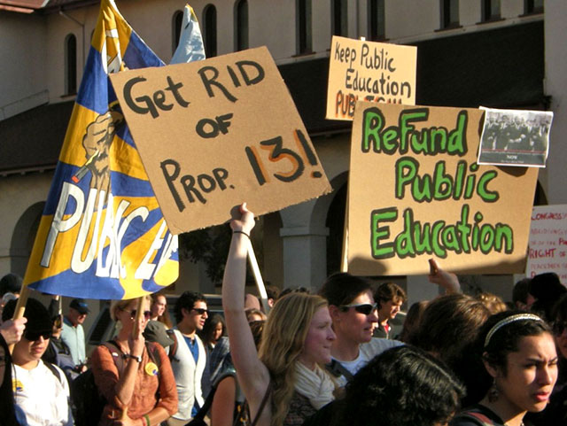 Students at the University of California, Berkeley display signs during a march on the day of a general strike, November 15, 2011. (Photo: Alex Chis)
