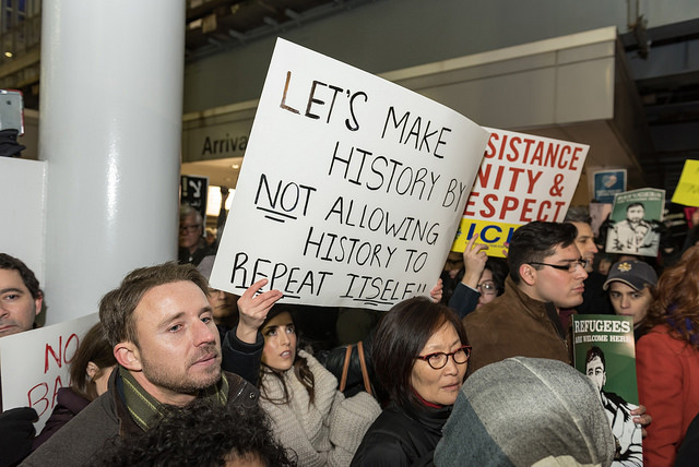 Activists display signs in the No Ban, No Wall protest at O'Hare International Airport in Chicago, Illinois, January 28, 2017. (Photo: Sarah Ji)