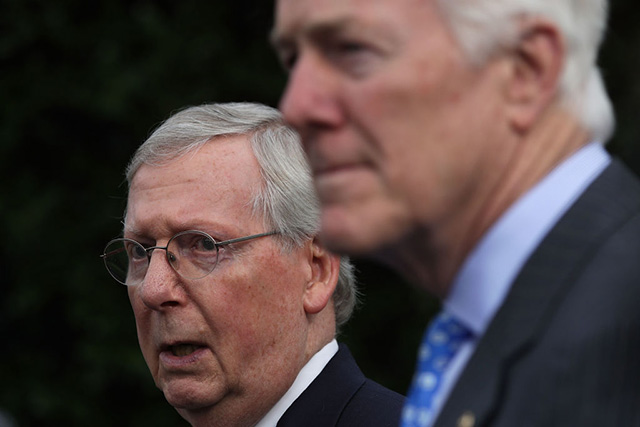 US Senate Majority Leader Sen. Mitch McConnell (left) and Senate Majority Whip Sen. John Cornyn speak to members of the media outside the West Wing of the White House in Washington, DC June 27, 2017. (Photo: Alex Wong / Getty Images)