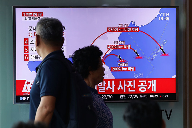 People watch a television broadcast reporting the North Korean missile launch at the Seoul Railway Station on July 4, 2017 in Seoul, South Korea. (Photo: Chung Sung-Jun / Getty Images)
