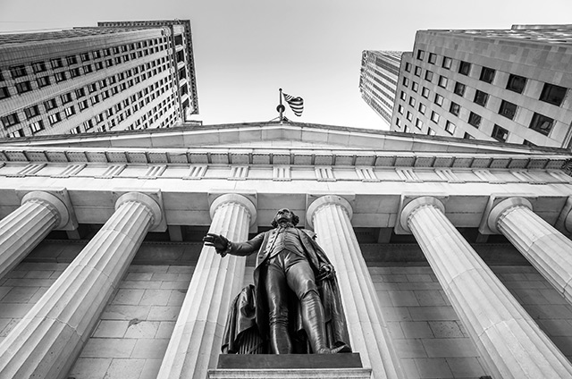 Facade of the Federal Hall with Washington Statue on the front, Wall Street, Manhattan, New York City. To rein in financial instability and other destructive financial practices, we not only must re-regulate finance — we must develop more public options in finance, (Photo: f11photo / iStock / Getty Images Plus)