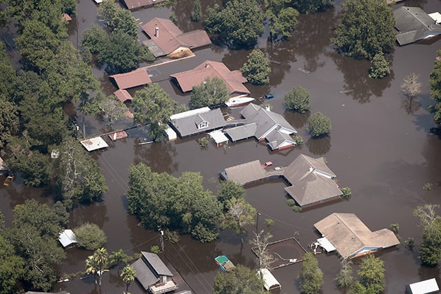 Homes are surrounded by floodwater after torrential rains pounded Southeast Texas following Hurricane and Tropical Storm Harvey on August 31, 2017, in Orange, Texas. (Photo: Scott Olson / Getty Images)