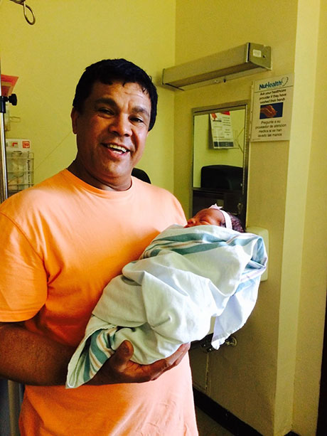 Eber Garcia Vasquez holds his newborn granddaughter. (Credit: Courtesy of the family of Eber Garcia Vasquez)