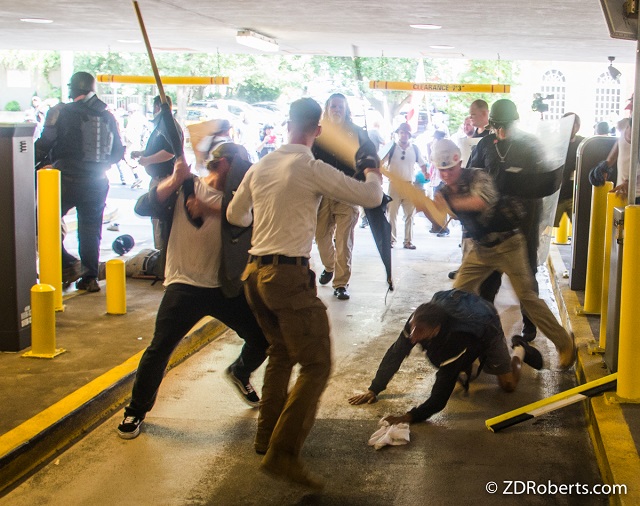 White supremacists beat Black schoolteacher DeAndre Harris in a parking garage in Charlottesville on August 12, 2017. (Photo: © Zach D. Roberts 2017)