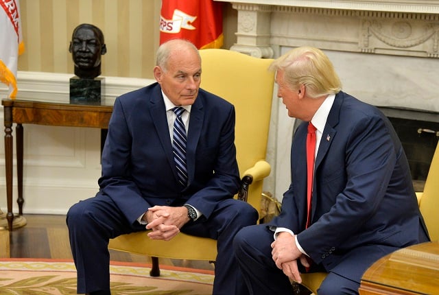 President Donald Trump (R) speaks to new White House Chief of Staff John Kelly after he was sworn in, in the Oval Office of the White House, July 31, 2017 in Washington, DC. Kelly, a retired Marine Corps general and formerly secretary of the Department of Homeland Security, replaces Reince Priebus. (Photo by Mike Theiler-Pool/Getty Images)