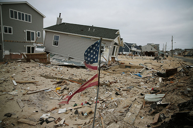  An American flag flies near homes that remain damaged and mostly untouched since Superstorm Sandy hit the coastline, May 5, 2013, in Ortley Beach, New Jersey. (Photo: Mark Wilson / Getty Images)