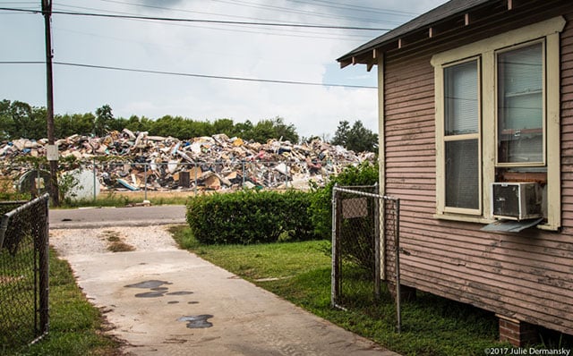 Home across the street from a temporary dumpsite on 19th Street in Port Arthur, Texas. (Photo: Julie Dermansky)