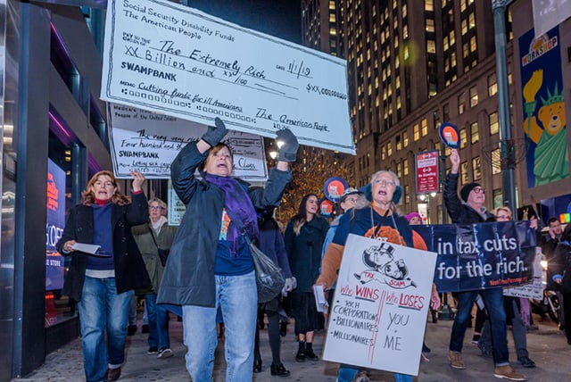 More than 100 protesters met at Greeley Square in Midtown Manhattan on November 27, 2017, and marched to raise awareness against the irresponsible GOP tax plan that cuts Medicare and increases healthcare costs for older New Yorkers. (Photo: Erik McGregor / Pacific Press / LightRocket via Getty Images)