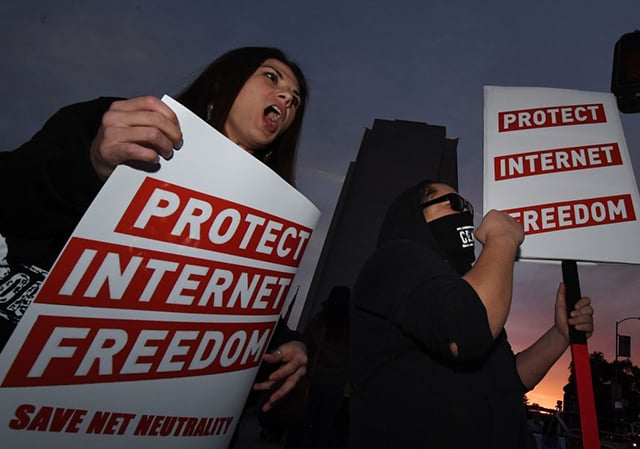 People protest during a rally to protect net neutrality as they voice their opposition to the impending FCC vote, outside the Federal Building in Los Angeles, California, on November 28, 2017. (Photo: MARK RALSTON / AFP / Getty Images)