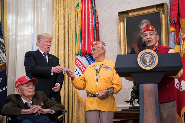 Donald Trump speaks during a meeting with Navajo Code Talkers including Fleming Begaye Sr., seated left, Thomas Begay, second from left, and Peter MacDonald, right, in the Oval Office at the White House in Washington, DC on Monday, Nov. 27, 2017. (Photo: Jabin Botsford / The Washington Post via Getty Images)